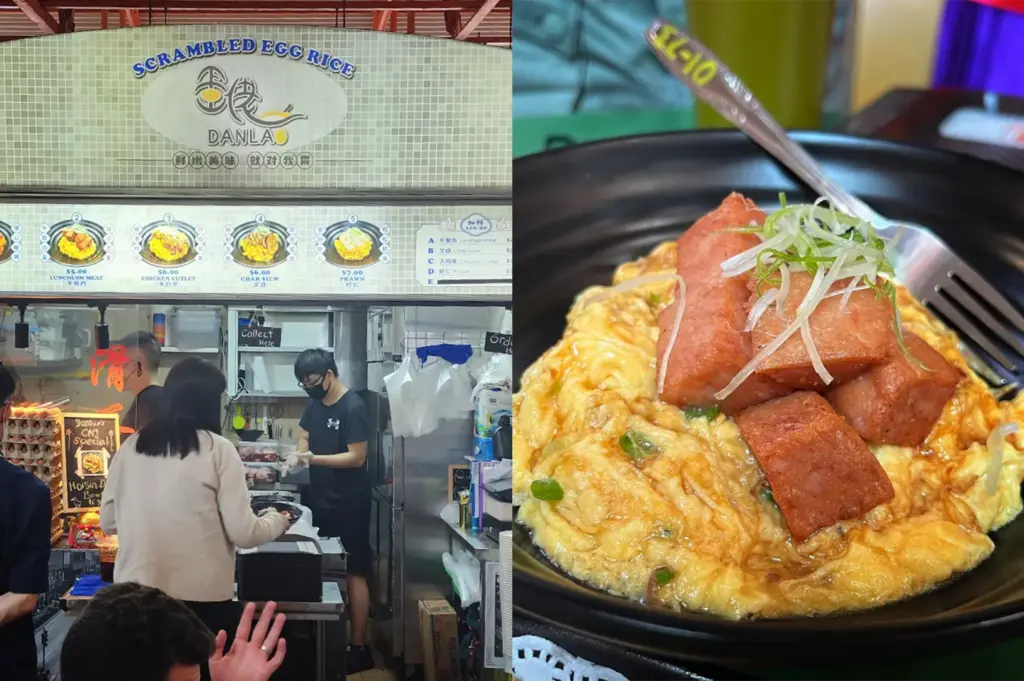 An eye-level, side-by-side split composition showcases a popular food stall and a close-up of its signature dish, representing the file "10 - Maxwell Food Centre 5 Hidden.webp". On the left, a vibrant blue hawker stall sign reads "Ah Tai Hainanese Chicken Rice" in English and Chinese above an illustrated menu, where customers stand at the counter waiting for their food and whole poached chickens hang inside a glass display window. On the right, a detailed overhead shot captures a classic plate of Hainanese chicken rice served on a white plastic plate over a textured green tray. The dish features a generous portion of fragrant, seasoned rice topped with tender, glistening slices of poached chicken, accompanied by pale green cucumber slices tucked along the top rim and a drizzle of dark soy sauce on the side, all paired with a small plastic dish of bright orange chili sauce at the top of the frame.