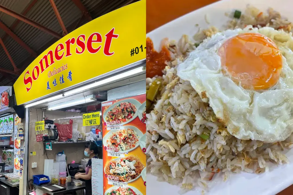 A split-screen composition featuring a hawker stall and its food. On the left, the "Somerset Delicacies" stall is shown with a bright yellow sign featuring red lettering. A woman wearing a blue face mask works behind the stainless steel counter, which is stocked with various containers and ingredients. A large menu board on the right of the stall displays photos of different fried rice and noodle dishes. The right side of the image is a close-up of a plate of silver fish fried rice. The rice is mixed with bits of egg and green onions, topped with a perfectly fried sunny-side-up egg with a bright orange, runny yolk. A small dollop of red chili paste is visible on the side of the white plate.
