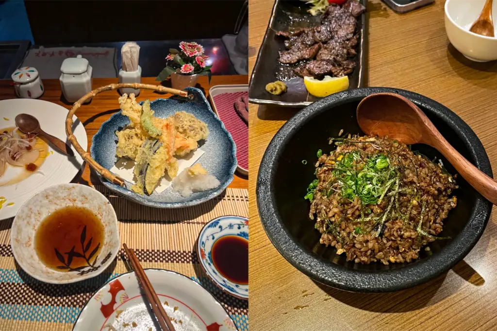 This split-composition image displays an enticing spread of traditional Japanese dishes served across two different table settings, representing the file "4-Beyond the Door Savoring Tranquility at Hanashizuku.webp". The left side features a basket-style blue ceramic bowl filled with crispy, golden-brown vegetable tempura paired with a mound of grated daikon radish, alongside a bowl of dipping sauce, chopsticks, a small plate of soy sauce, and a partially eaten carpaccio dish on a woven placemat. The right side shows a top-down view of a dark, stone-like bowl packed with savory garlic fried rice garnished with shredded nori and finely chopped green scallions, accompanied by a large wooden spoon, while a rectangular black platter of grilled wagyu beef or steak with a lemon wedge rests just behind it on a smooth wooden table.